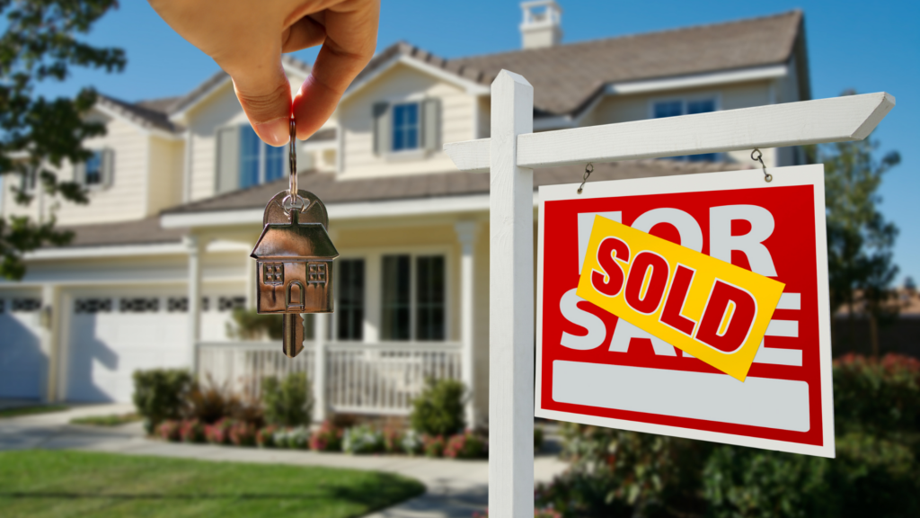 Cozy home with a 'Sold' sign, symbolizing new ownership and the potential for immediate remortgaging.