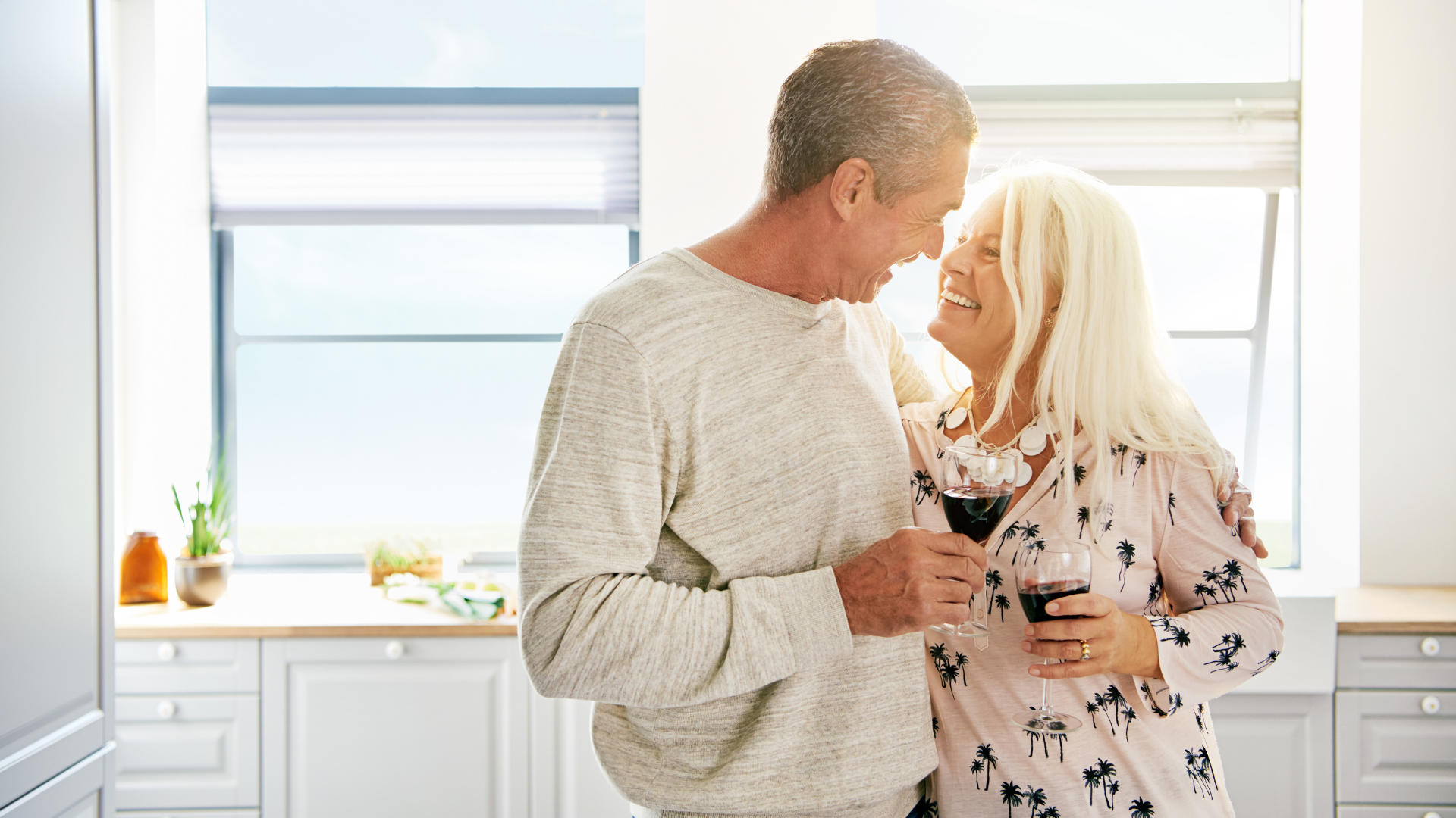 A senior couple in their cosy living room, symbolising financial security and comfort with elements representing equity release, like a piggy bank and financial documents.