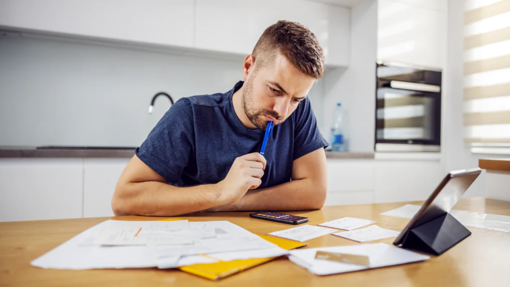 An overwhelmed individual surrounded by paperwork with a path leading to a 'Debt Consolidation' document, against a backdrop of a London landmark.